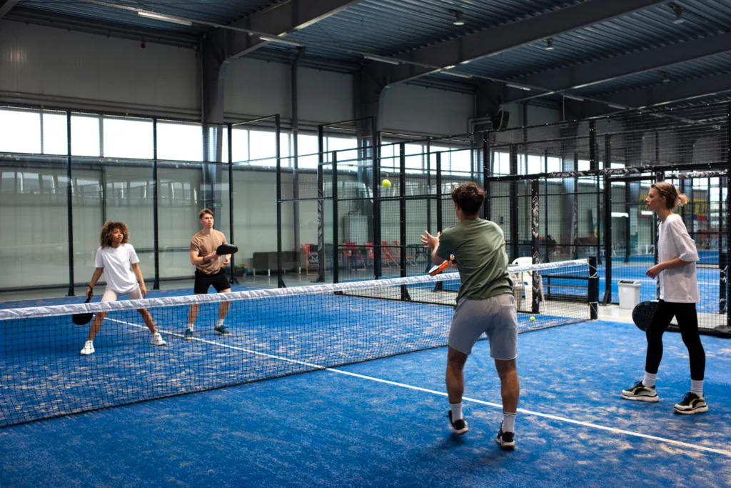 people-playing-padle-tennis-inside-group