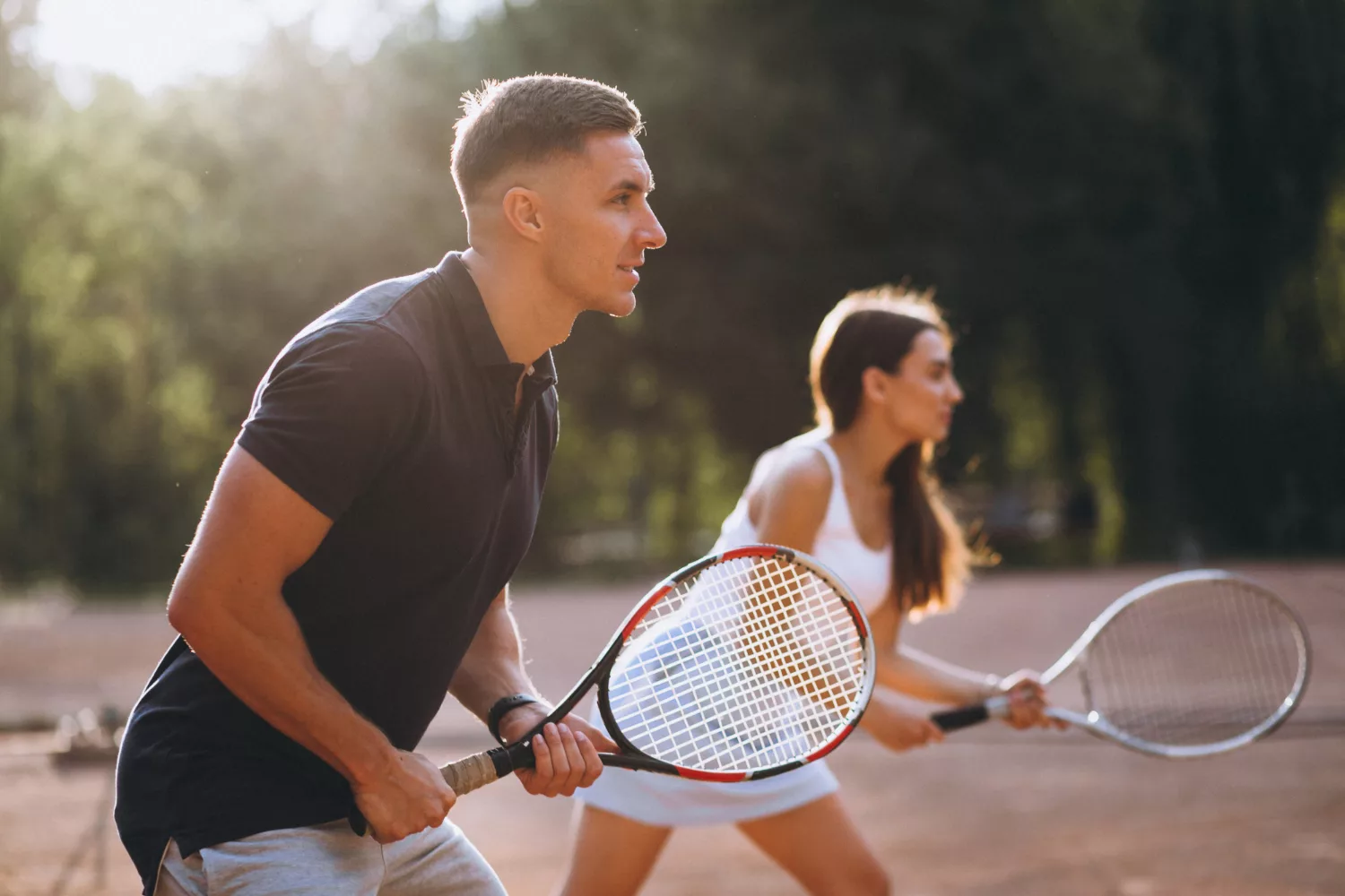 young-couple-playing-tennis-court
